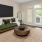 a living room with a green couch