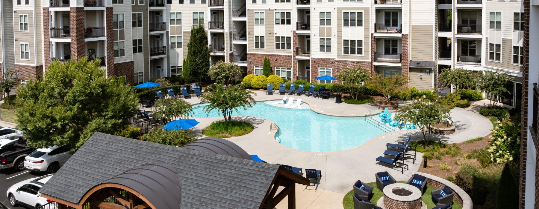 a large building with a pool in front of it